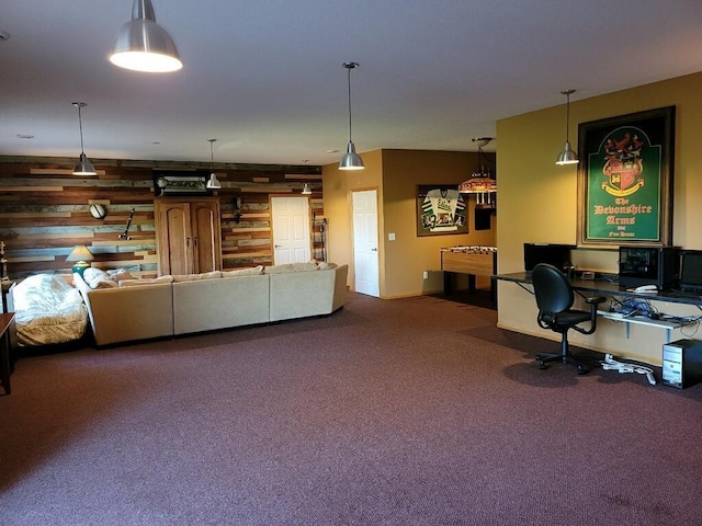 interior space with carpet floors and wood walls