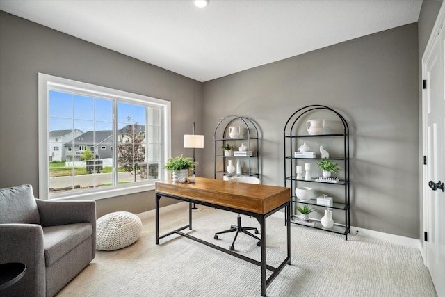 carpeted office featuring baseboards