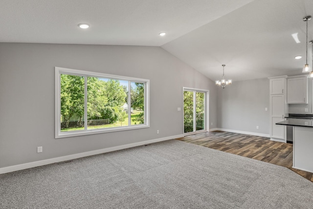 unfurnished living room with recessed lighting, visible vents, baseboards, vaulted ceiling, and an inviting chandelier