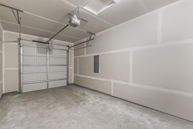 garage featuring electric panel and a garage door opener