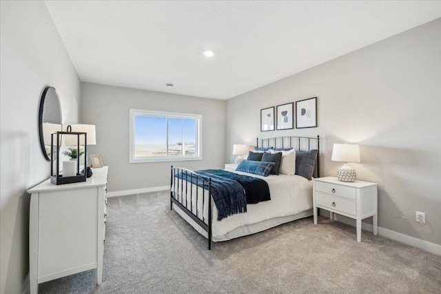 bedroom featuring carpet floors and baseboards