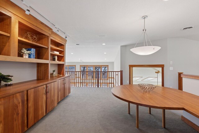6 Black Lake Rd, North Oaks, MN 55127 - dining room featuring light colored carpet and rail lighting