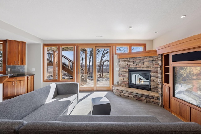 6 Black Lake Rd, North Oaks, MN 55127 - carpeted living room featuring a fireplace