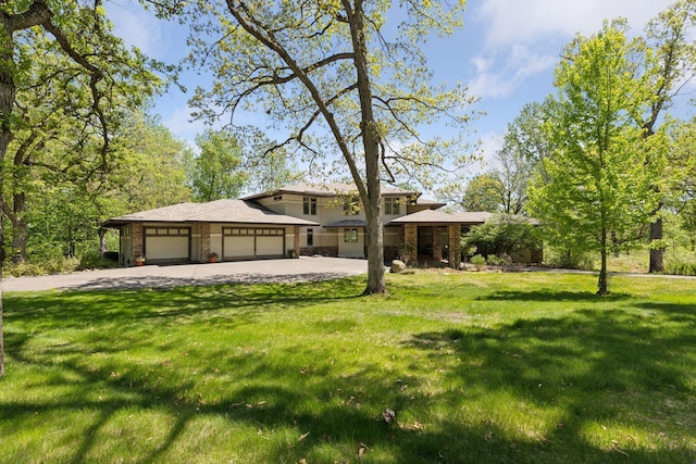 6 Black Lake Rd, North Oaks, MN 55127 - prairie-style house with driveway, an attached garage, a front lawn, and stone siding