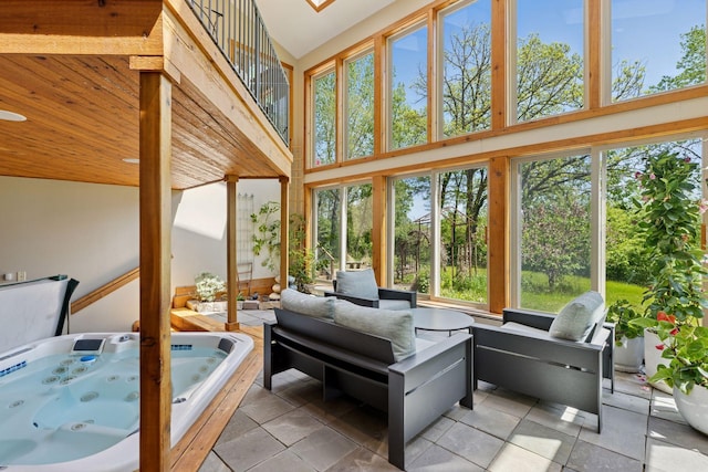 6 Black Lake Rd, North Oaks, MN 55127 - sunroom with plenty of natural light, a high ceiling, a hot tub, and tile patterned flooring