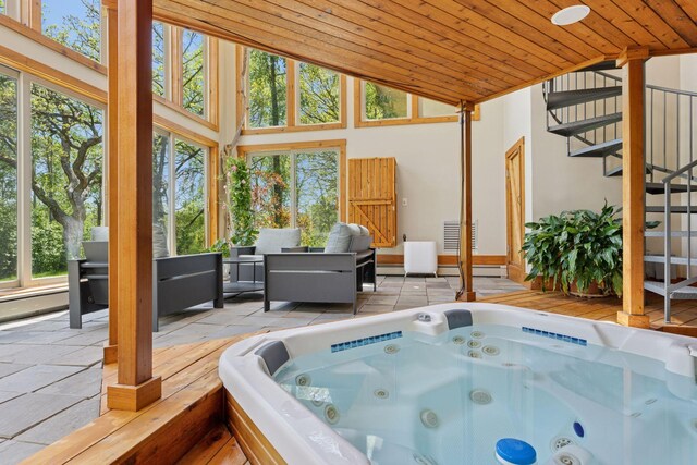6 Black Lake Rd, North Oaks, MN 55127 - sunroom with lofted ceiling, a jacuzzi, and baseboard heating