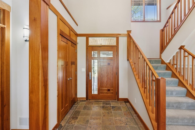 6 Black Lake Rd, North Oaks, MN 55127 - foyer entrance featuring dark stone finish floors, stairs, and baseboards