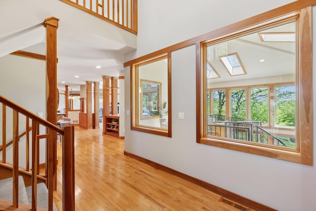 6 Black Lake Rd, North Oaks, MN 55127 - entrance foyer with light wood finished floors, a skylight, stairs, baseboards, and recessed lighting