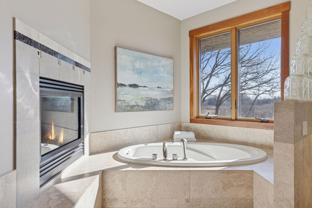 6 Black Lake Rd, North Oaks, MN 55127 - bathroom featuring a garden tub, healthy amount of natural light, and a tiled fireplace