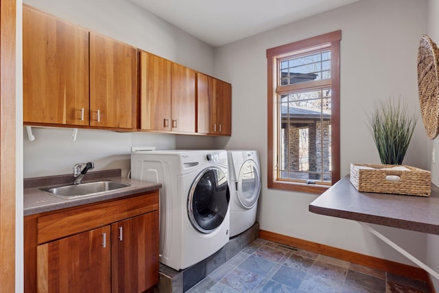 6 Black Lake Rd, North Oaks, MN 55127 - laundry room with washer and dryer, cabinet space, baseboards, and stone tile floors