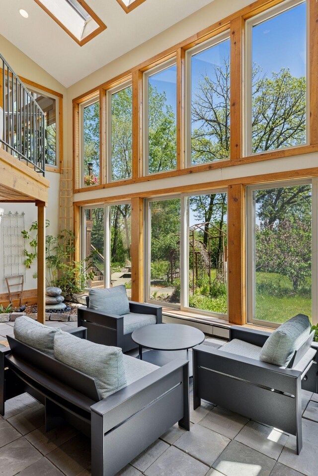 6 Black Lake Rd, North Oaks, MN 55127 - sunroom with healthy amount of natural light, a skylight, and vaulted ceiling