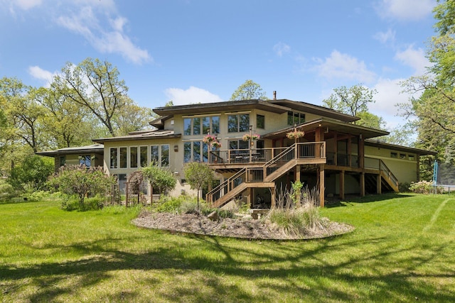 6 Black Lake Rd, North Oaks, MN 55127 - back of house with stairway, a lawn, stucco siding, and a wooden deck