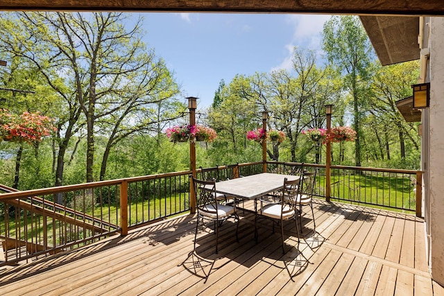6 Black Lake Rd, North Oaks, MN 55127 - wooden deck featuring outdoor dining space and view of wooded area