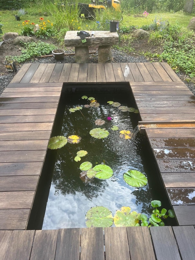 6 Black Lake Rd, North Oaks, MN 55127 - wooden terrace featuring a small pond