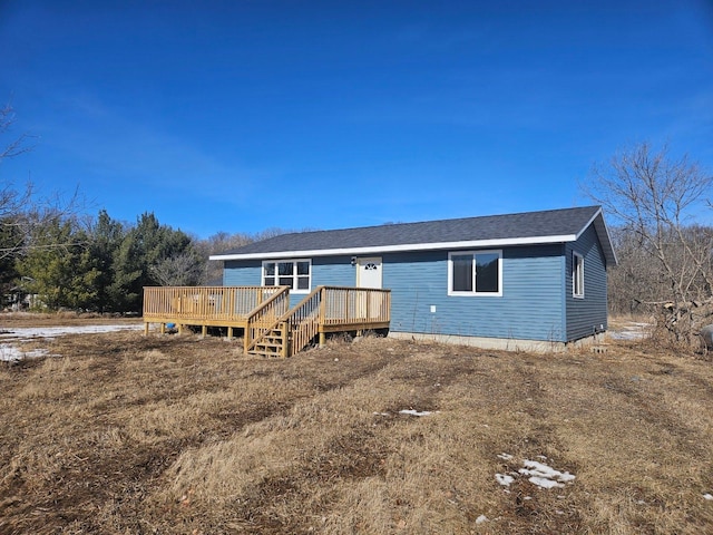 view of front of property with a wooden deck