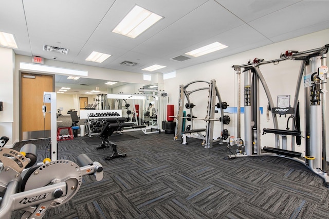 workout area featuring visible vents and carpet floors