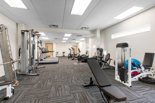 exercise room with visible vents and carpet