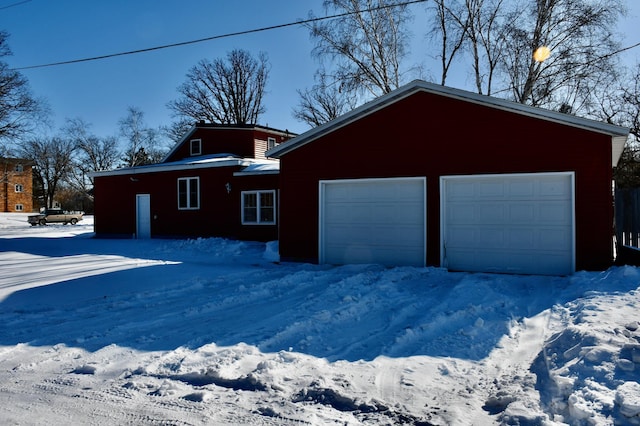 view of snow covered garage