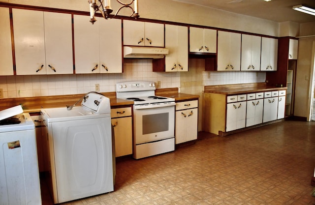 kitchen featuring washer / dryer, electric stove, under cabinet range hood, and backsplash