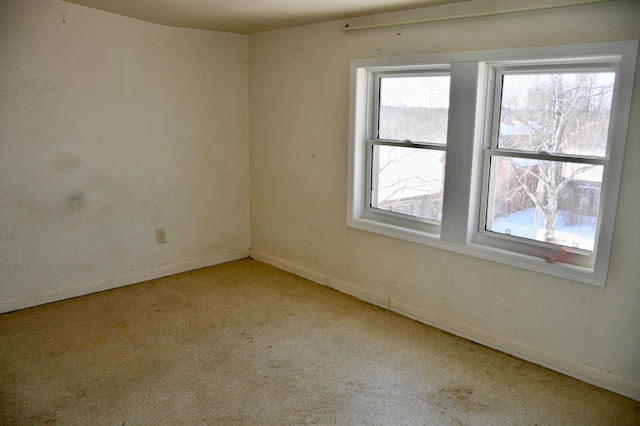 empty room with baseboards