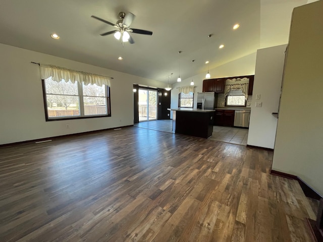 unfurnished living room featuring ceiling fan, dark wood-style flooring, recessed lighting, and baseboards