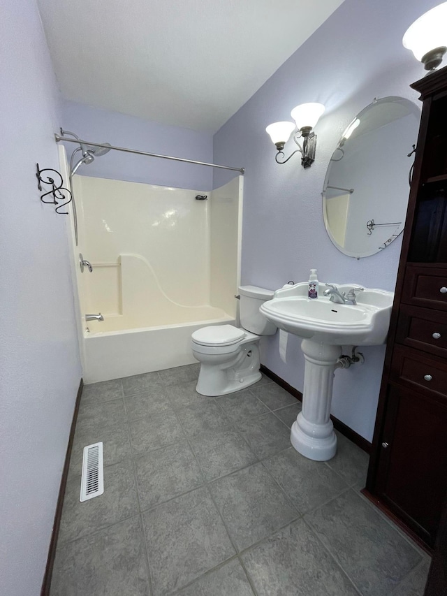 full bath featuring toilet, bathing tub / shower combination, baseboards, visible vents, and tile patterned floors