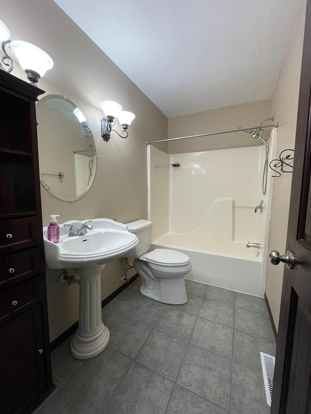 full bath with visible vents, toilet,  shower combination, tile patterned flooring, and baseboards