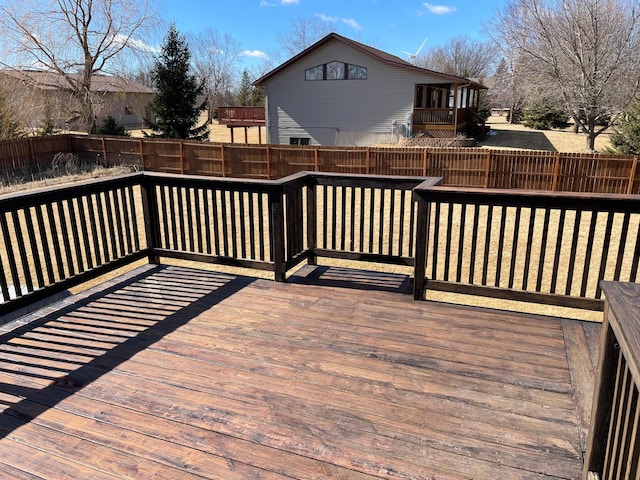 deck with a fenced backyard