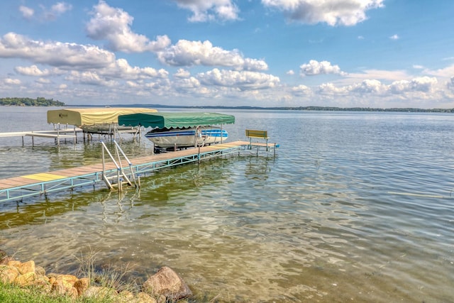 view of dock featuring a water view and boat lift