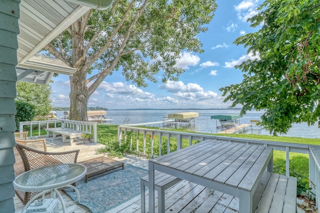 wooden deck with a water view