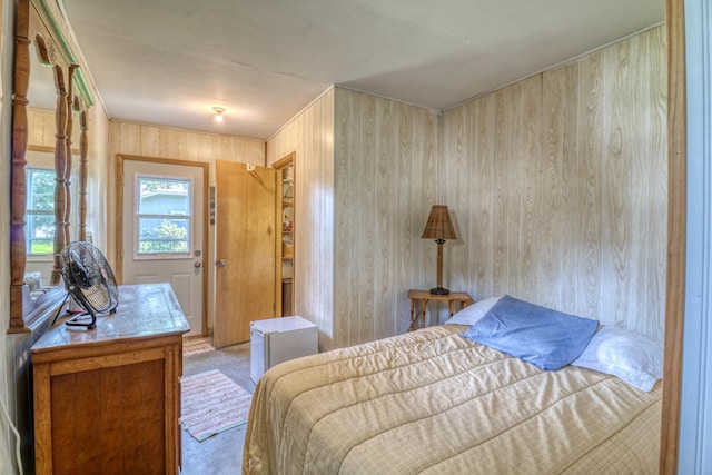 bedroom with wooden walls