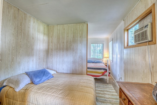 bedroom featuring a wall unit AC