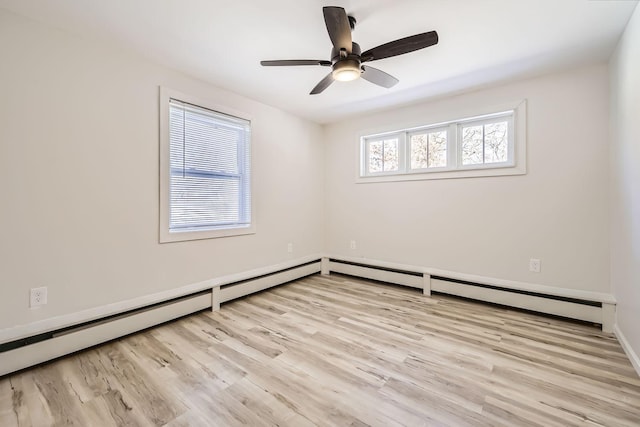 spare room with wood finished floors and a ceiling fan