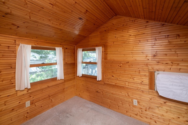 bonus room featuring lofted ceiling, wood walls, wooden ceiling, and carpet