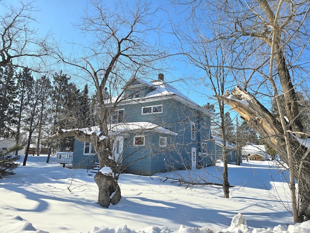 view of front of house with a chimney