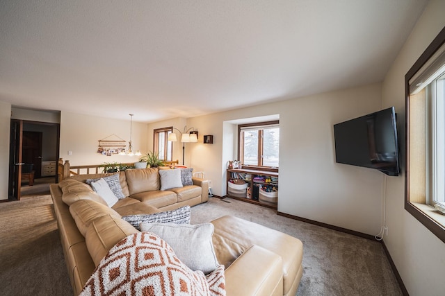 living room with carpet flooring and baseboards