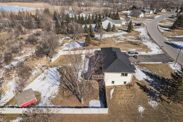 snowy aerial view featuring a residential view