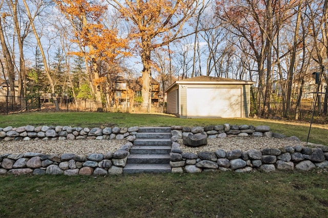 view of yard featuring an outdoor structure and fence