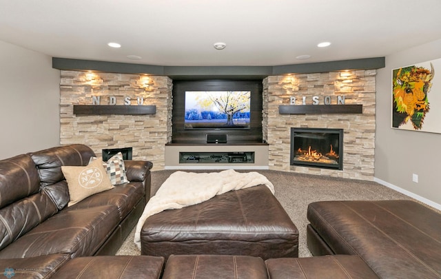 living area featuring a stone fireplace, recessed lighting, carpet flooring, and baseboards