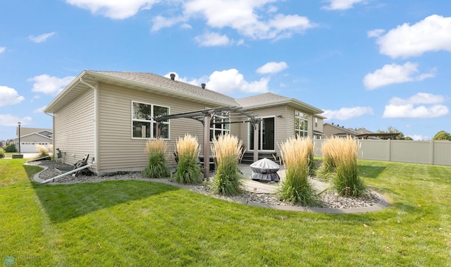 back of property with a lawn, fence, and a pergola