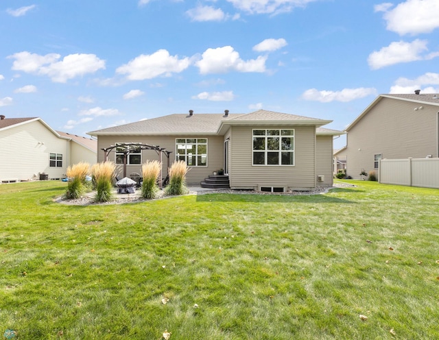 rear view of property with a patio area, fence, a pergola, and a yard