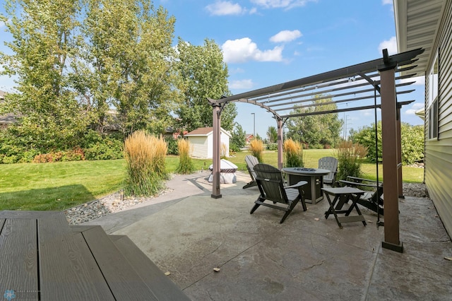 view of patio / terrace with a storage shed, an outdoor fire pit, an outdoor structure, and a pergola