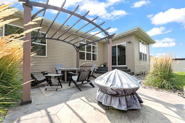 view of patio / terrace with fence and a pergola