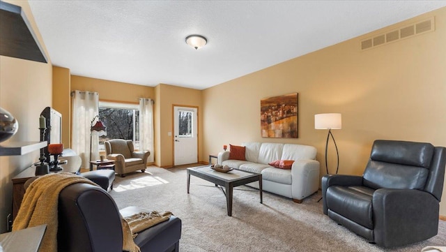 living area with carpet floors and visible vents