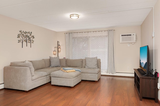 living area with a baseboard heating unit, a wall mounted AC, and wood finished floors