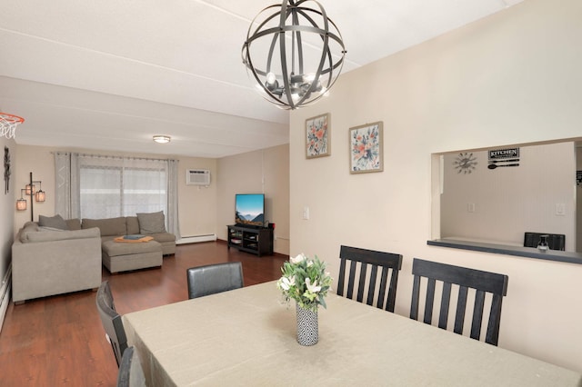 dining area with a baseboard heating unit, wood finished floors, a wall mounted AC, and a chandelier