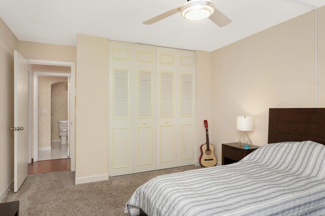 bedroom featuring a closet, carpet flooring, and ceiling fan