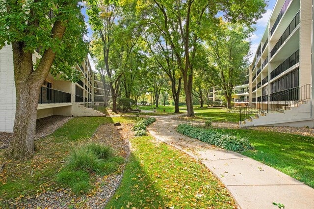 view of home's community with a lawn