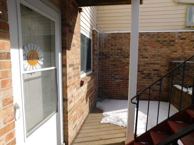 exterior space featuring brick siding