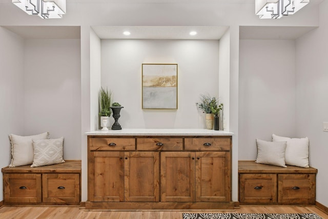 mudroom featuring light wood finished floors and recessed lighting